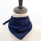 Navy blue bandana with white floral pattern on a mannequin head.