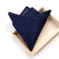 Navy blue Japanese cotton pocket square in a wooden box on a white background