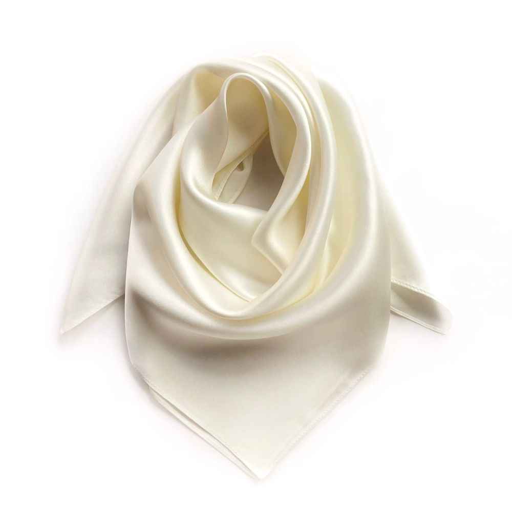 an folded ivory mulberry silk bandana scarf on white background