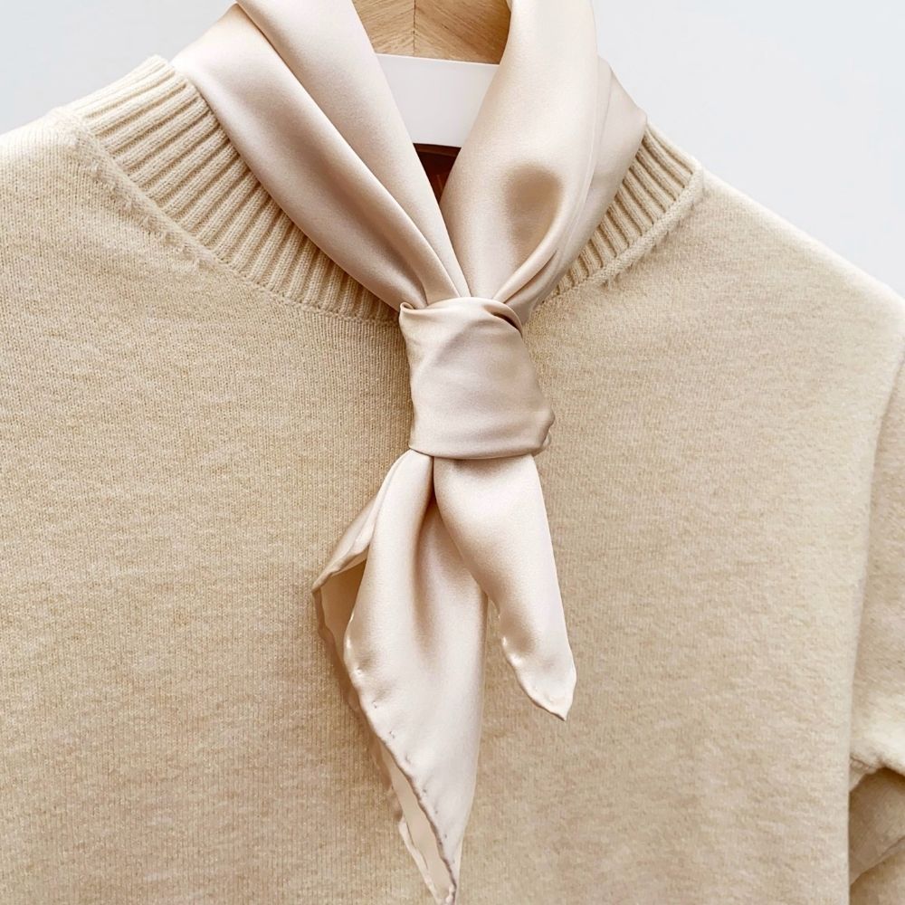 Pearl Cream silk scarves with machine-finished and hand-rolled hems displayed together