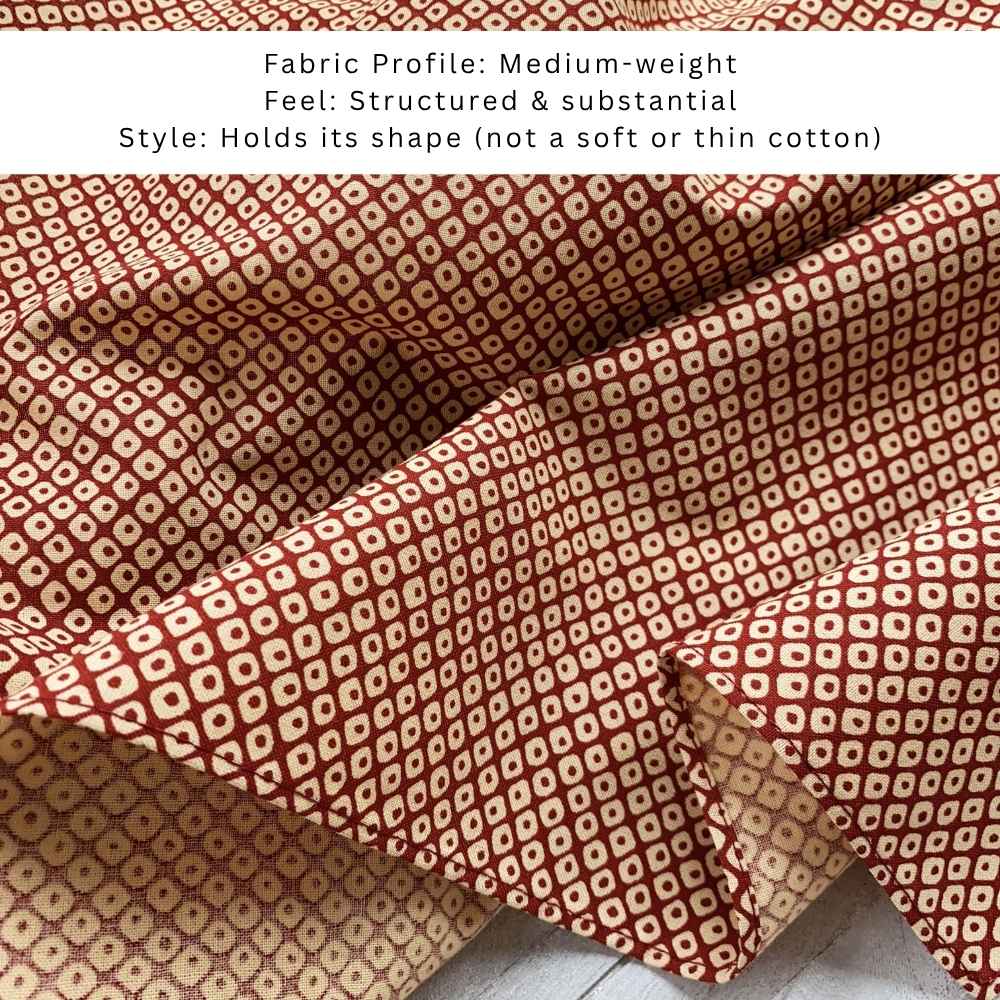 Close-up of red Kanoko Japanese cotton fabric, medium-weight structured cotton with fawn-spot pattern