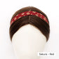 Red skinny headband with floral pattern worn on a mannequin head, labeled 'Sakura - Red'.