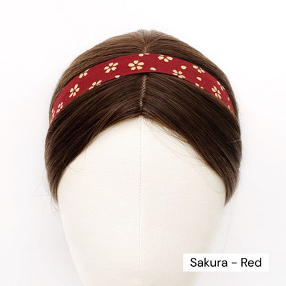 Red skinny headband with floral pattern worn on a mannequin head, labeled 'Sakura - Red'.