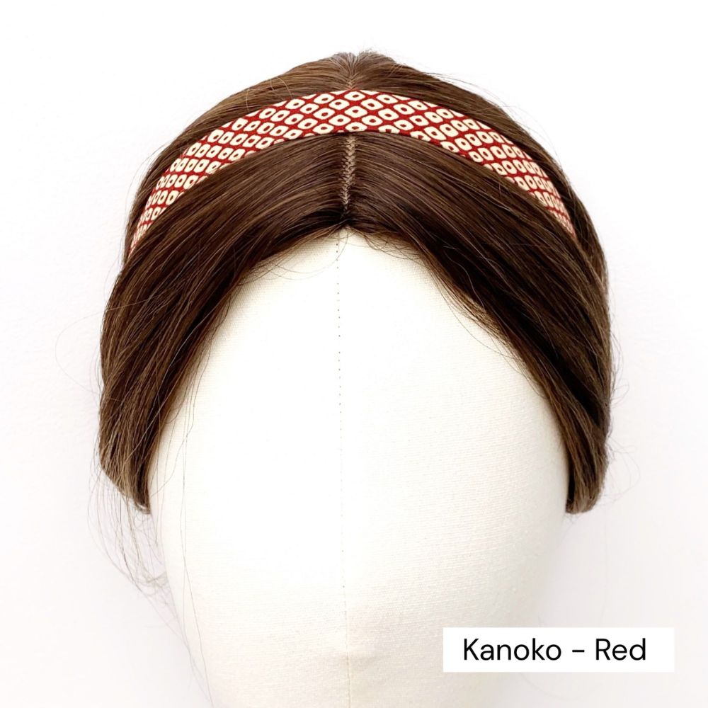Red skinny cotton headband with red and white pattern on a mannequin head, labeled 'Kanoko - Red'.
