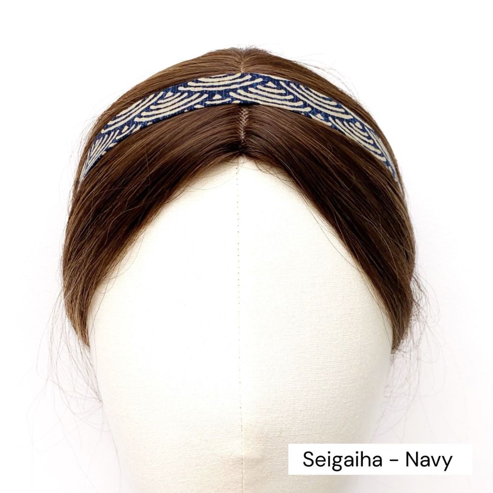 Navy skinny cotton  headband with Japanese wave patterns on a mannequin head against a white background