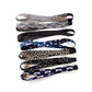 Skinny Japanese cotton headbands in navy blue, beige, and black, arranged vertically on a white background.