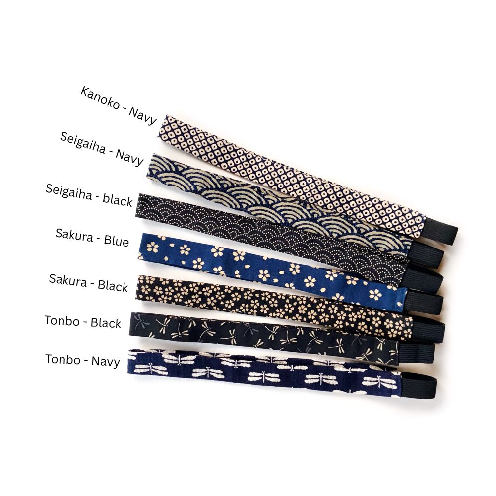 Set of Japanese patterned skinny cotton headbands with labels on a white background