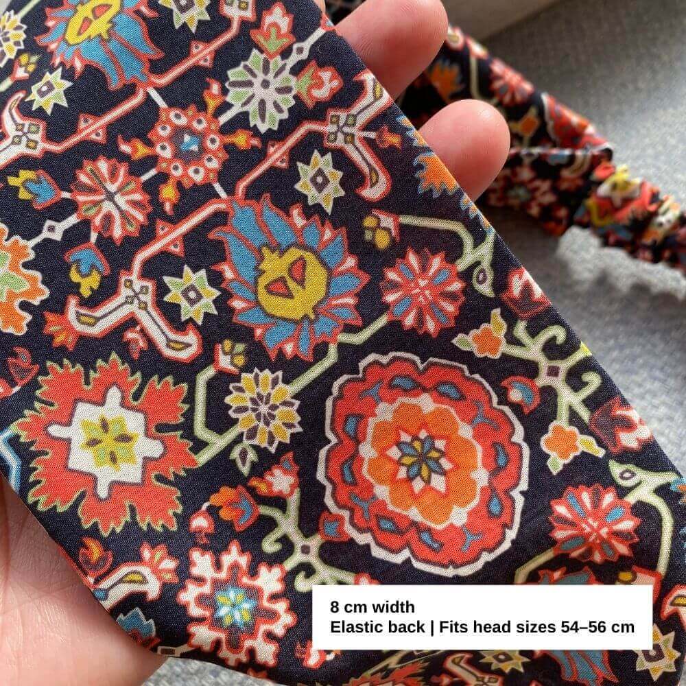 Close-up of the Liberty Cecil cotton headband fabric, showing the intricate bohemian floral motifs and rich colours.