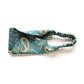 Paisley patterned headband on a white background