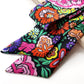 Colorful floral patterned  Liberty silk skinny scarf on a white background