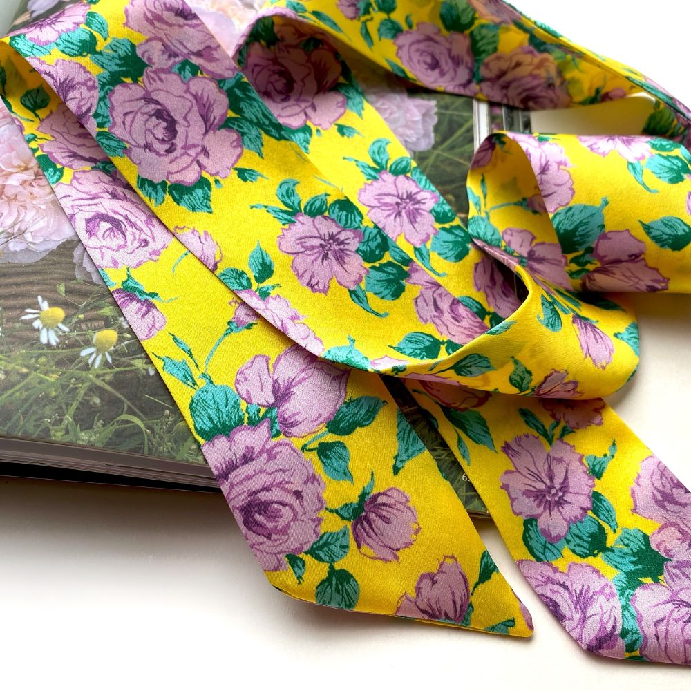 liberty rose floral-patterned yellow skinny silk scarf on a white background 