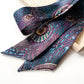 Liberty of London silk satin skinny scarf featuring the Royal Hera peacock print on a white background