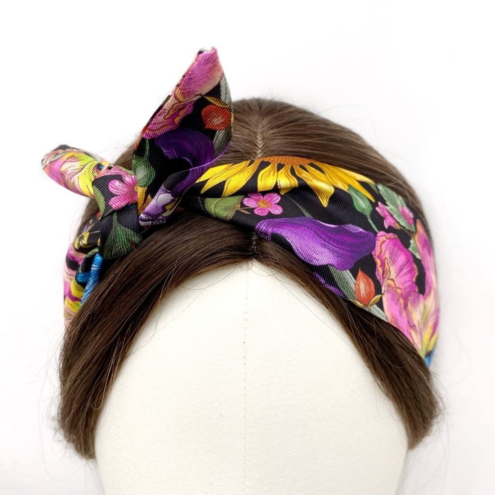 black and purple yellow floral Liberty London silk twilly scarf styled as headband scarf
