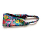 Liberty London Tana Lawn cotton headband with a vibrant multicolor floral print on a teal background, featuring a matching elastic back, photographed on a clean white background.