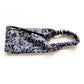 Liberty London Tana Lawn cotton headband with a dark navy blue background and a detailed animal print.