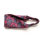 Liberty London Tana Lawn cotton headband with a dense floral and birds pattern in magenta, blue, and white.