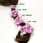 Set of lilac pure mulberry silk satin scrunchies and hair ties of different sizes on a ponytail with labeled sizes.