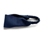 A dark navy flat linen headband with an elastic back, displayed on a clean white background.