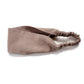 A wide muted taupe-brown color flat linen headband with an elastic back, displayed on a clean white background.