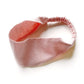 A pastel pink linen headband with an elastic back, displayed on a clean white background.