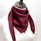 mannequin wears a burgundy mulberry silk square scarf around her neck