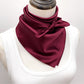 mannequin wears a burgundy mulberry silk square scarf around her neck