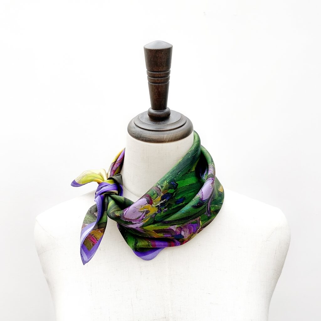 green purple mulberry silk square neck scarf on a mannequin with a white background