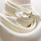 closed up of an ivory mulberry silk neck scarf 