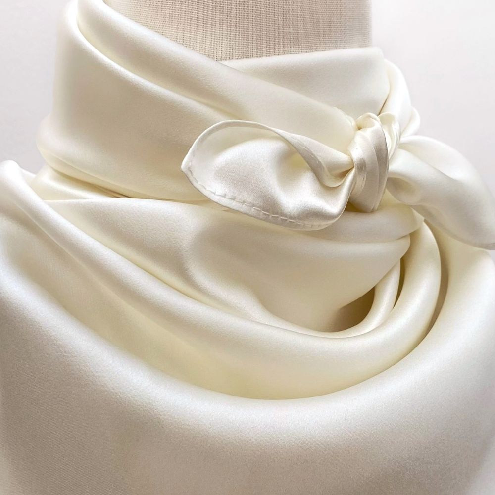 closed up of an ivory mulberry silk neck scarf 