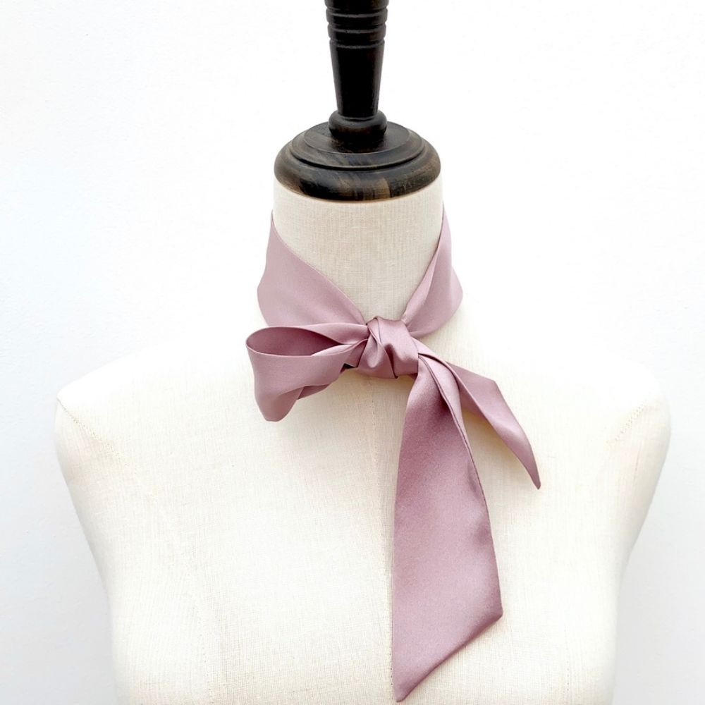 mauve mulberry silk satin skinny scarf tied around mannequin's neck