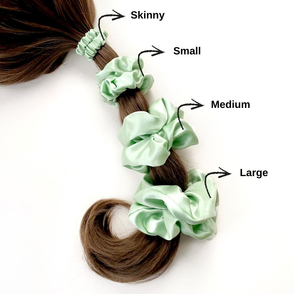 Mint green mulberry silk hair scrunchies  and hair ties of different sizes on a white background