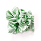 Set of mint green mulberry silk scrunchies and hair ties on a white background