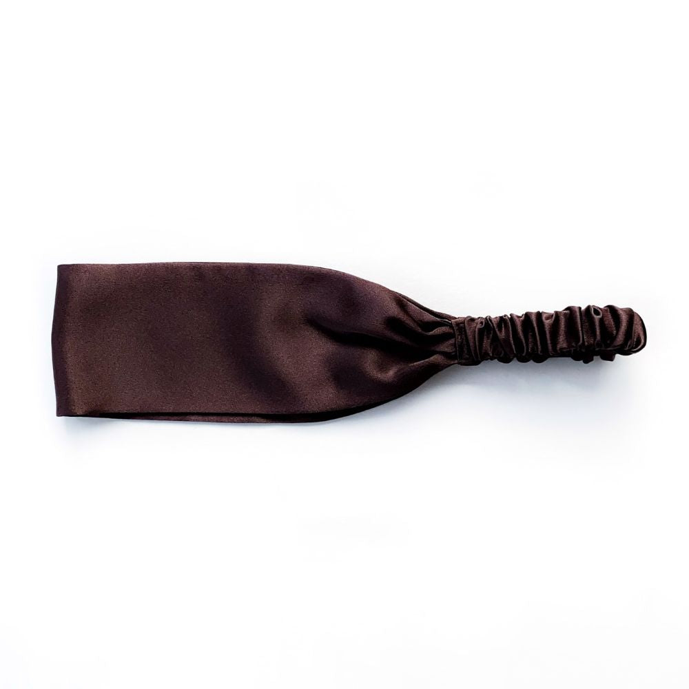 Brown silk satin headband on a white background
