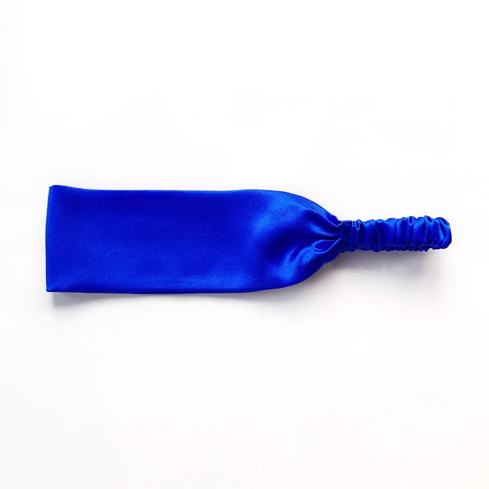 Royal Blue silk satin headband on a white background