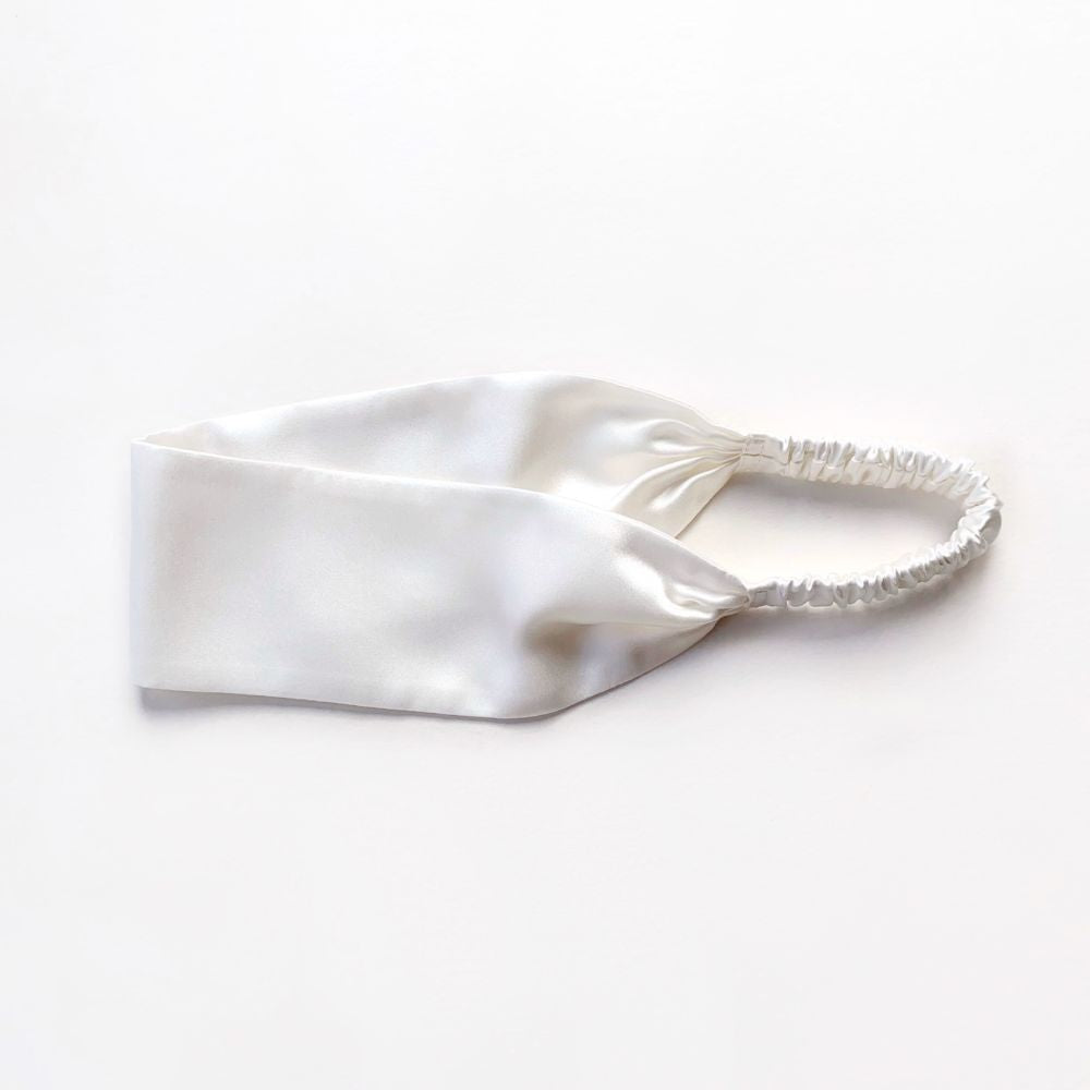 White silk satin headband on a white background