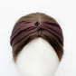 A chocolate brown twisted mulberry silk satin headband displayed on a white mannequin head.