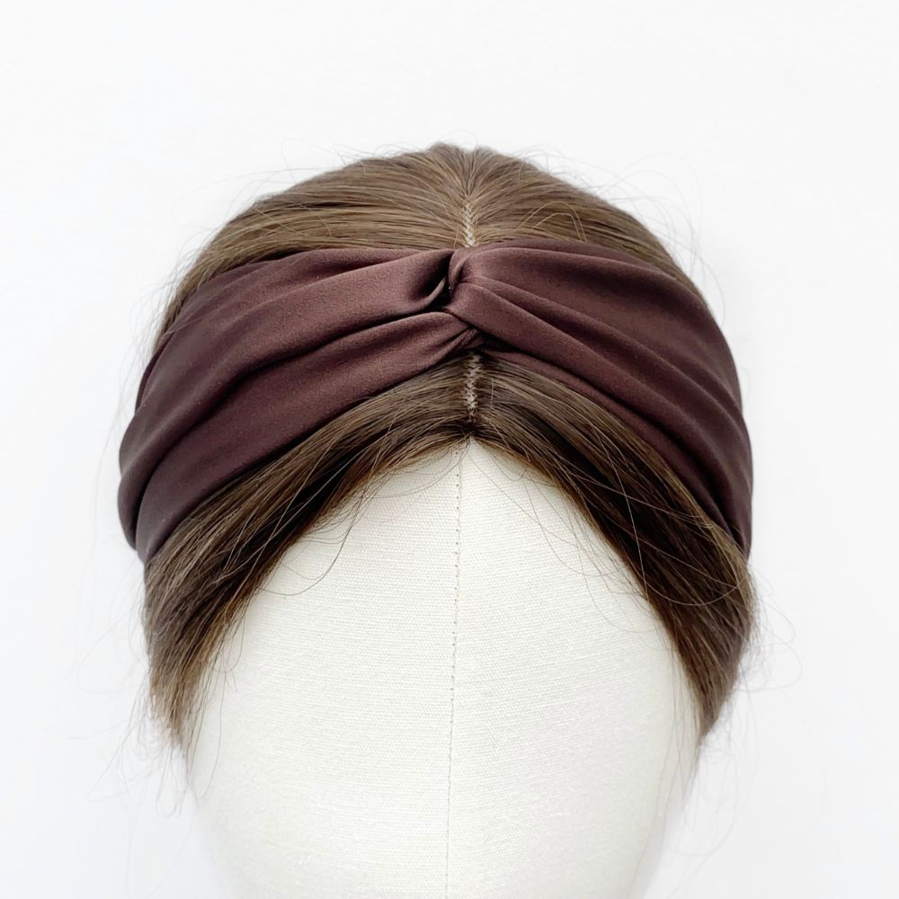 A chocolate brown twisted mulberry silk satin headband displayed on a white mannequin head.