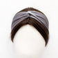 grey twisted mulberry silk satin headband  displayed on a white mannequin head with dark brown hair.