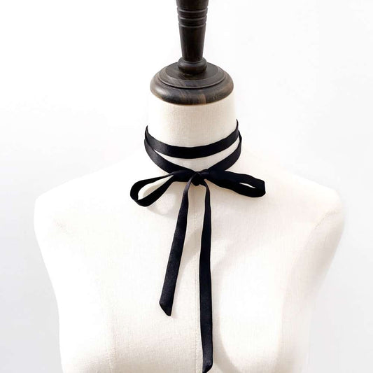Black mulberry silk ribbon choker on a mannequin with a white background