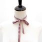 Mannequin wear a muted purple mulberry silk satin ribbon bow on a white background