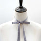 Mannequin wearing a gray mulberry silk skinny ribbon neck tie scarf against a white background