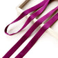 purple mulberry silk satin ribbon on a white surface