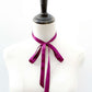Mannequin wearing a purple mulberry silk ribbon scarf on a white background