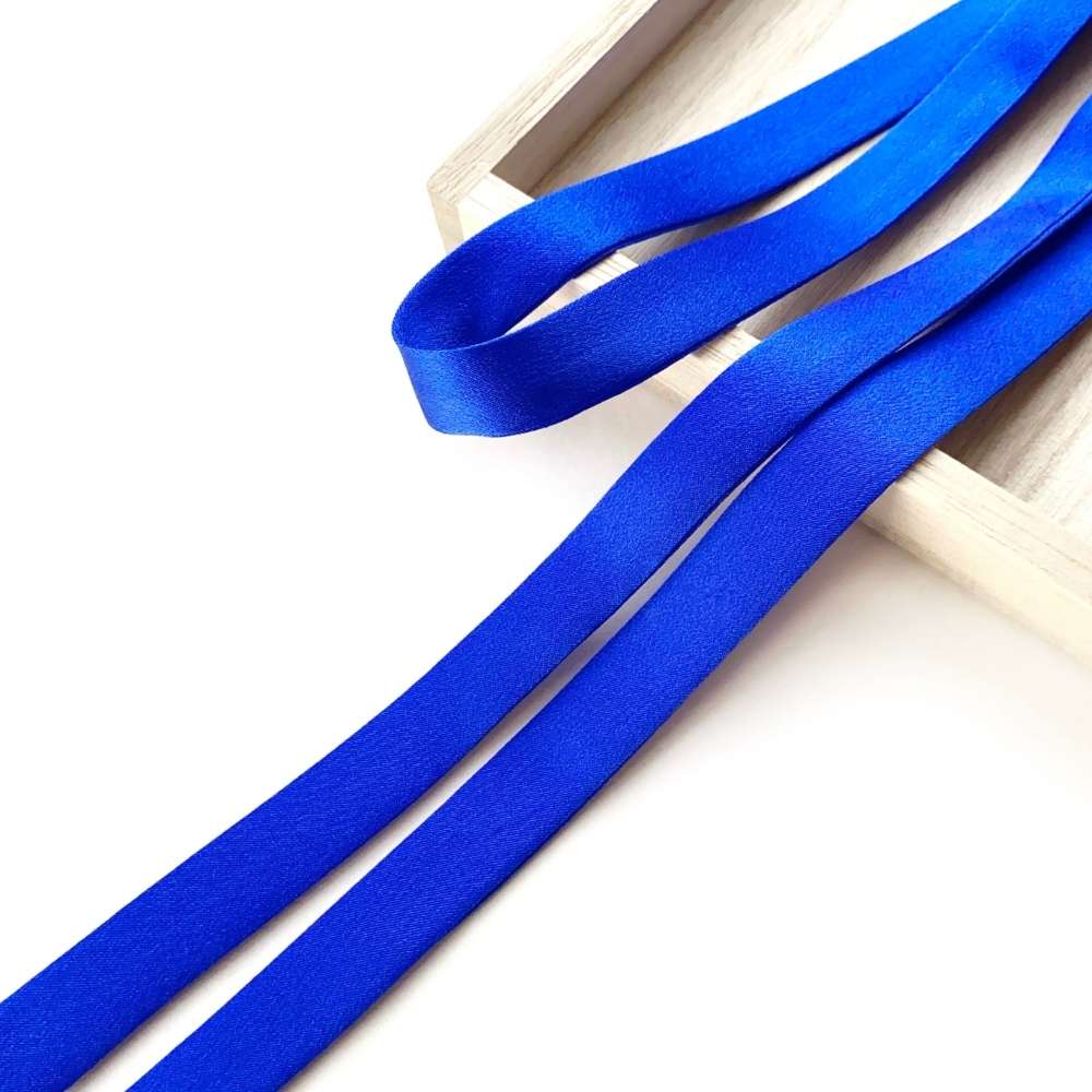 Royal blue mulberry silk ribbon scarf on a white background