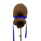 Mannequin head with brown hair styled in a bun and royal blue silk ribbon hair tie on a white background
