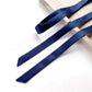 sapphire blue mulberry silk satin ribbon scarf on a light wooden surface