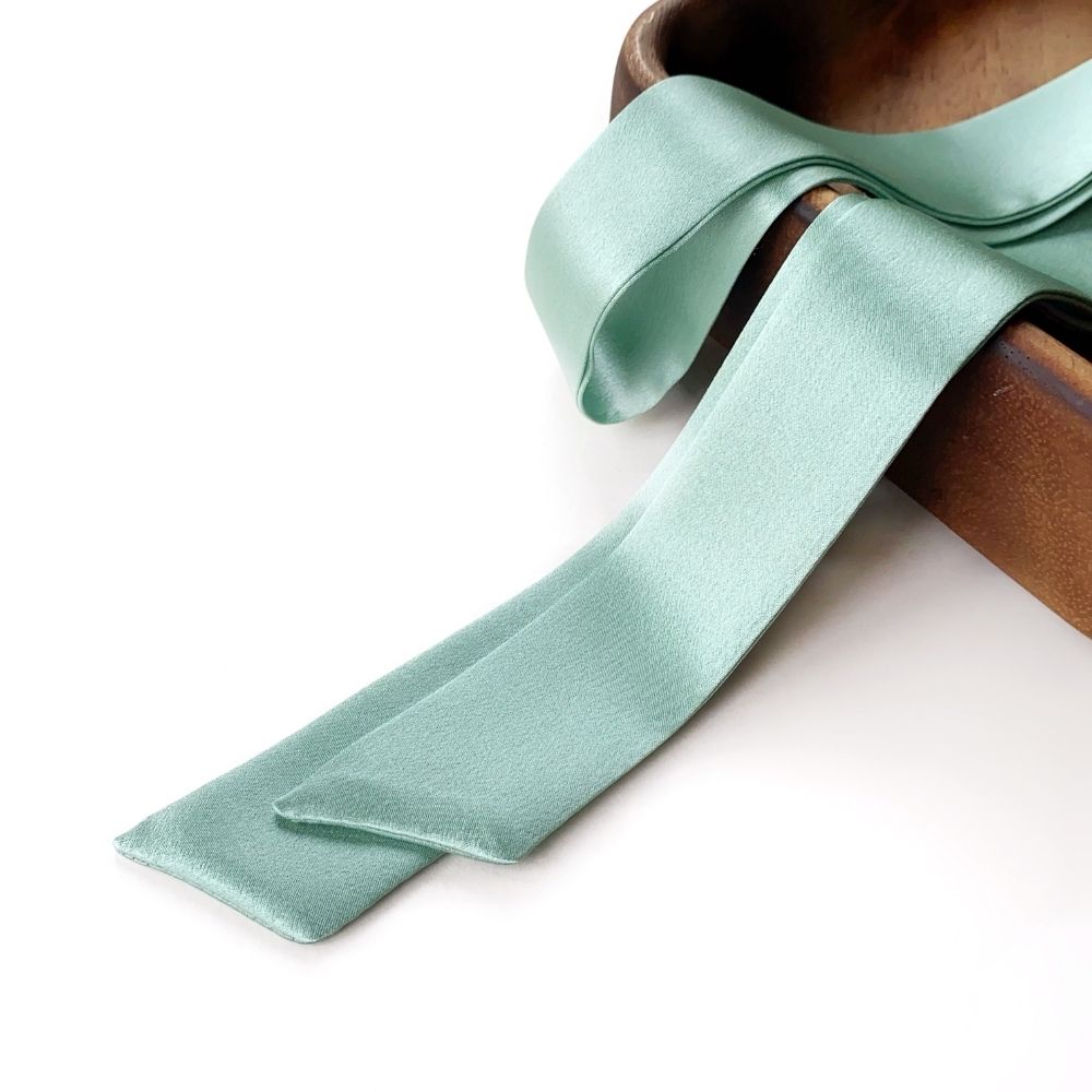 A mint green mulberry silk skinny scarf