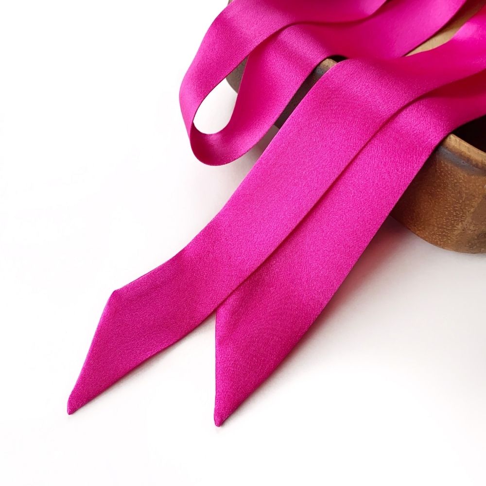 A bright fuchsia pink mulberry silk skinny scarf