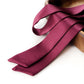 A deep burgundy mulberry silk skinny scarf