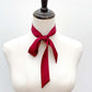 Red mulberry silk satin skinny scarf tied around a mannequin neck on a white background